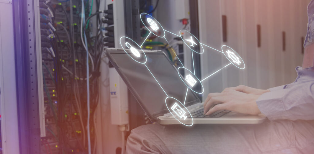 Smartphone apps icons against technician sitting on swivel chair using laptop to diagnose servers 3d