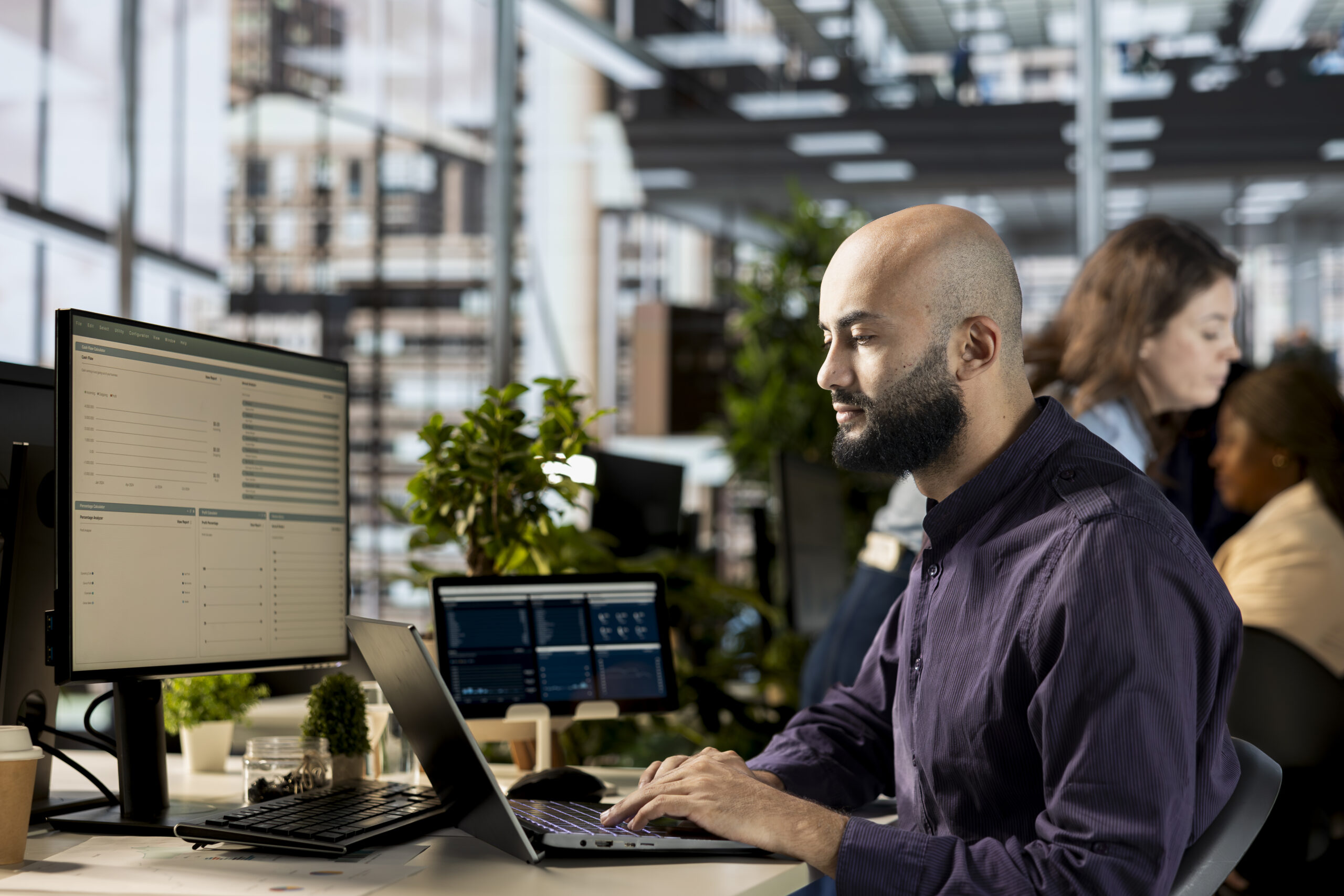 Executive manager reviewing statistics and online reports for development, strategic planning for an effective resource allocation. Employee does financial forecasting in the office.